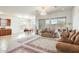 Spacious living room featuring large windows, tile flooring, neutral walls, and elegant furnishings at 6336 S Granite St, Gilbert, AZ 85298