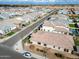 This aerial view displays a residential street lined with well-maintained single-Gathering homes, tidy landscaping, and clear roads at 6336 S Granite St, Gilbert, AZ 85298