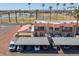 Aerial view of townhomes with manicured grounds, palm trees, and convenient covered parking at 6345 N 49Th Ave, Glendale, AZ 85301