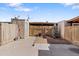 View of a quaint fenced backyard with a storage shed and clear skies above at 6345 N 49Th Ave, Glendale, AZ 85301