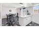 Bright dining area features a table with seating and a stylish kitchen island at 6345 N 49Th Ave, Glendale, AZ 85301