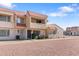 Exterior of a two-story townhome featuring a red tile roof and a balcony at 6345 N 49Th Ave, Glendale, AZ 85301