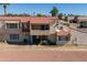 Inviting multi-level townhome featuring a red tile roof, a private balcony, and well-maintained landscaping at 6345 N 49Th Ave, Glendale, AZ 85301