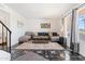 Cozy living room with modern decor, a plush sofa, a decorative rug, and stylish accents for a welcoming atmosphere at 6345 N 49Th Ave, Glendale, AZ 85301