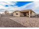 Paver patio extends into backyard, great for outdoor activities and enjoying open space at 65 W Cucumber Tree Ave, San Tan Valley, AZ 85140