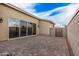 Paver patio connects to backyard, providing extra outdoor space for activities and gathering at 65 W Cucumber Tree Ave, San Tan Valley, AZ 85140