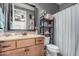 Bathroom featuring modern vanity with soft lighting, and decorative shelves and towels at 65 W Cucumber Tree Ave, San Tan Valley, AZ 85140