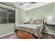 Inviting bedroom with cozy bedding, soft carpet, and calming green walls at 65 W Cucumber Tree Ave, San Tan Valley, AZ 85140