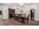 Elegant dining room with ample seating for large gatherings and wood floors at 65 W Cucumber Tree Ave, San Tan Valley, AZ 85140