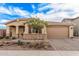 Inviting single-Gathering home with landscaped front yard and a two-car garage offering curb appeal at 65 W Cucumber Tree Ave, San Tan Valley, AZ 85140