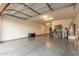 Spacious garage with epoxy flooring and ample storage space at 65 W Cucumber Tree Ave, San Tan Valley, AZ 85140