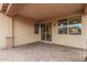 Covered patio features tile flooring and access to the backyard, perfect for relaxation at 65 W Cucumber Tree Ave, San Tan Valley, AZ 85140