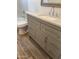 Well-lit bathroom with a modern sink and a tiled floor at 6532 N 60Th N Ave, Glendale, AZ 85301