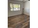 Bright bedroom featuring wood floors and view to the outside at 6532 N 60Th N Ave, Glendale, AZ 85301