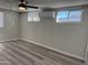 Bright bedroom with wood flooring, a ceiling fan and mini-split system at 6532 N 60Th N Ave, Glendale, AZ 85301