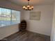 Dining room with rustic decor, wine cabinet, and a view of the front yard at 6532 N 60Th N Ave, Glendale, AZ 85301