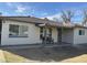 Charming single-story home with a covered front porch and a cozy seating area at 6532 N 60Th N Ave, Glendale, AZ 85301