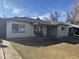 Charming single-story home with a covered front porch and cozy seating area at 6532 N 60Th N Ave, Glendale, AZ 85301