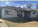 Charming single-story home with a covered front porch and a cozy seating area at 6532 N 60Th N Ave, Glendale, AZ 85301