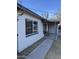 Charming single-story home featuring a covered front porch with comfortable seating at 6532 N 60Th N Ave, Glendale, AZ 85301