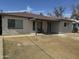 Charming single-story home with a covered porch and a well-maintained front yard at 6532 N 60Th N Ave, Glendale, AZ 85301