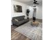 Cozy living room with gray sofa, hardwood floors and area rug at 6532 N 60Th N Ave, Glendale, AZ 85301