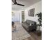 Inviting living room with gray sofa, hardwood floors, and accent plants at 6532 N 60Th N Ave, Glendale, AZ 85301