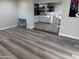 Open concept living room with hardwood floors flowing into the kitchen at 6532 N 60Th N Ave, Glendale, AZ 85301