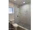 Updated shower with modern tile and a rainfall showerhead at 6532 N 60Th N Ave, Glendale, AZ 85301