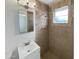 Updated bathroom featuring a stand up shower, stylish fixtures, and tiled walls at 7020 E Oak St, Scottsdale, AZ 85257