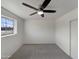 This bedroom has neutral walls, a ceiling fan, and lots of natural light at 7020 E Oak St, Scottsdale, AZ 85257