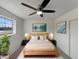 Serene bedroom featuring a modern ceiling fan and natural light at 7020 E Oak St, Scottsdale, AZ 85257