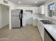 Well-lit kitchen featuring modern stainless steel appliances and ample cabinet space at 7020 E Oak St, Scottsdale, AZ 85257