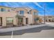 Exterior townhome with stone facade and well-maintained landscape at 729 E Zesta Ln # 102, Gilbert, AZ 85297