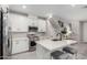 Bright kitchen featuring white cabinetry, stainless steel appliances, and a quartz countertop island at 729 E Zesta Ln # 102, Gilbert, AZ 85297