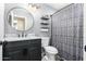 Bathroom featuring modern fixtures, a commode, and a shower and tub combo with a decorative shower curtain at 7456 E Milagro Ave, Mesa, AZ 85209