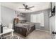 Comfortable bedroom featuring gray walls and modern ceiling fan at 7456 E Milagro Ave, Mesa, AZ 85209