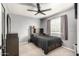 Bedroom with gray walls, a ceiling fan, window, and a full size bed at 7456 E Milagro Ave, Mesa, AZ 85209