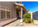 Inviting front porch with decorative wreath and lush greenery at 7456 E Milagro Ave, Mesa, AZ 85209