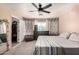 Comfortable main bedroom with ceiling fan, walk in closet, and natural light at 7456 E Milagro Ave, Mesa, AZ 85209