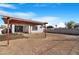 Spacious backyard featuring a covered patio and a block fence for added privacy and security at 7510 N 59Th Ln, Glendale, AZ 85301