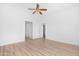 Spacious bedroom with a ceiling fan, a neutral color palette, and access to a walk-in closet at 7510 N 59Th Ln, Glendale, AZ 85301