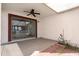 Covered patio featuring ceiling fan and sliding door at 7510 N 59Th Ln, Glendale, AZ 85301