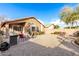 An inviting backyard offers a patio and a gravel area for outdoor entertaining at 757 E Lovegrass Dr, San Tan Valley, AZ 85143