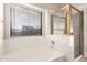 Bathroom featuring a bathtub with a window, a shower, and natural light at 757 E Lovegrass Dr, San Tan Valley, AZ 85143