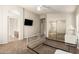 Bedroom featuring carpet flooring, vaulted ceilings, a mirrored closet, and a ceiling fan at 757 E Lovegrass Dr, San Tan Valley, AZ 85143