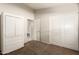 A well-lit bedroom features neutral carpet, closet, and an adjoining bathroom at 757 E Lovegrass Dr, San Tan Valley, AZ 85143