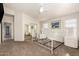 Spacious carpeted bedroom with mirrored closet doors, ceiling fan, and white trim at 757 E Lovegrass Dr, San Tan Valley, AZ 85143