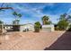 Backyard view highlighting the storage shed and desert landscaping at 7645 E Gale Ave, Mesa, AZ 85209