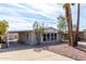 Charming home featuring a covered parking area and desert landscaping at 7645 E Gale Ave, Mesa, AZ 85209